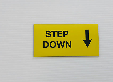 Yellow acrylic piece with black engraved