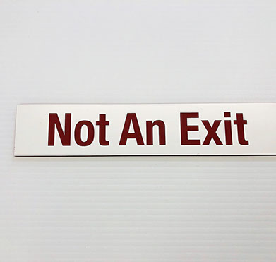 White acrylic piece with red engraving