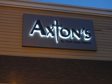 Channel letter on an exterior wall night view