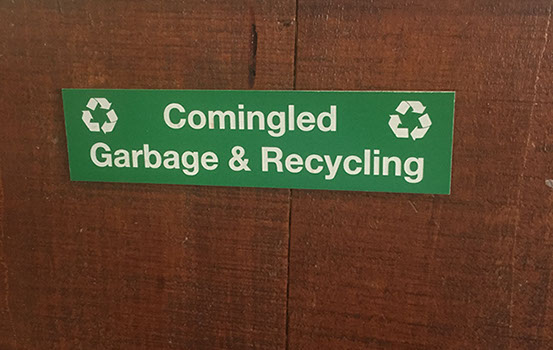 Green acrylic piece with white letters engraving sign