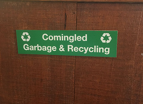 Green acrylic piece with white letters engraving sign