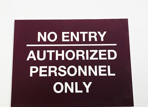 Burgundy acrylic piece with white engraving